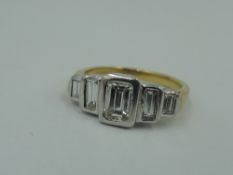 A five stone baguette cut diamond ring of graduated form, total approx 0.75ct, in a stepped collared
