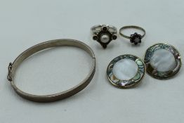A small selection of silver and white metal jewellery including silver hinged bangle, Artisan
