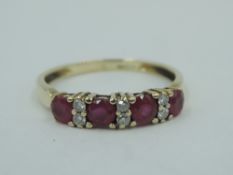 A 9ct gold half eternity ring having four rubies interspersed by diamond chips,size O & approx 1.5g