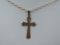 A yellow metal cross pendant stamped 9ct on an open link fine 9ct gold chain, approx 17' & 3.2g