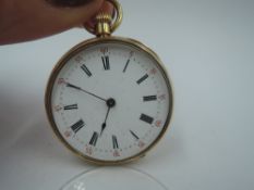A small Victorian yellow metal top wound pocket watch having Roman numeral dial and perimeter minute