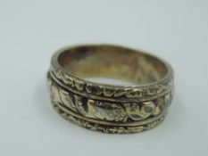 A white and yellow metal band ring having moulded decoration, no marks, size R/S & approx 5.9g