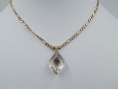 A 9ct gold figaro link chain with magnetic clasp, approx 18' & 10.2g with a smoky cut glass pendant