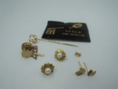 A small selection of 9ct gold and yellow metal including two stick pins, two pairs of stud
