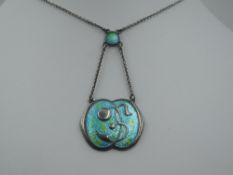 An Art Nouveau silver and enamel pendant by Charles Horner in shades of green and turquoise with