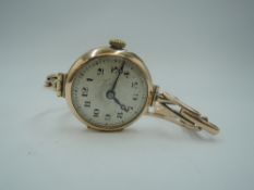 A vintage 9ct rose gold wrist watch having Arabic numeral dial with rolled gold stretch strap,