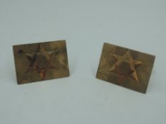 A pair of 9ct gold cufflinks having engraved stars to front panels with bar connectors, approx 10g