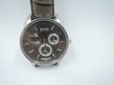 A gent's automatic wrist watch by Hugo Boss having baton numeral dial with a trio of central dials