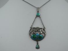 An Art Nouveau silver and enamel pendant by Charles Horner in shades of green and turquoise with