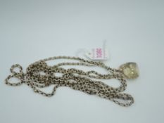 A yellow metal belcher link muff chain with 9ct gold fob having facet cut citrine style stone ,no
