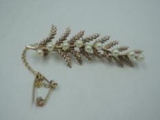 A 9ct gold brooch modelled as a branch having seed pearl decoration, (AF) approx 4.5g