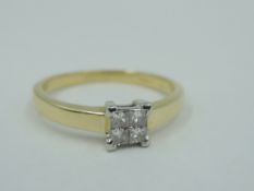 A four stone princess cut diamond ring in a four claw square setting, total approx 0.333ct on an