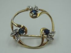 A 9ct gold brooch having a trio of sapphire and diamond set petals in a circular mount, approx 2.8g