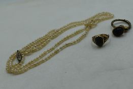 A long string of seed pearls, approx 29', a small wooden cannister stamped Perry & Co London, a