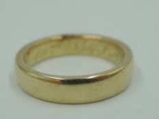 A Victorian yellow metal wedding band bearing dated inscription to inside, no marks, tested as 18ct,