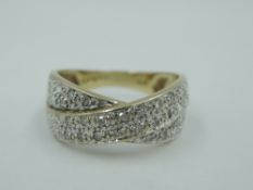 A 9ct gold diamond chip set cross over dress ring, total appro 0.11ct, sizeL & approx 3.4g