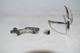 Three pieces of HM silver including a wishbone cuff bangle and identity bracelet bearing 1977 Silver