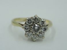 A diamond cluster dress ring, total approx 0.04ct in a claw set mount on a yellow metal loop, no