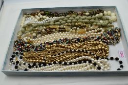 A tray of costume jewellery strings of beads and simulated pearls including Carolee, Tommy