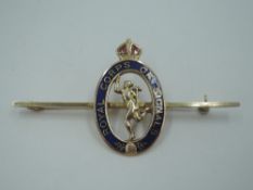 A yellow metal regimental bar brooch for the Royal Corps Of Signals stamped 9ct, having blue and red