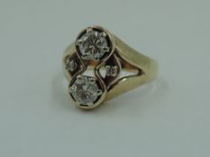 A diamond duo dress ring, total approx 1ct flanked by two diamond chips in an open claw set bordered