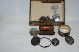 A vintage tin containing a small selection HM silver and white metal including Mexican pendant,