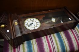 A late 20th Century reproduction wall clock in the 19th Century style having mahogany effect case,