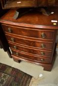 A reproduction Regency dwarf chest of four bedside or similar drawers