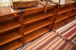 Two pairs of reproduction mahogany bookshelves, one set labelled Shaw of London