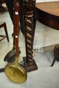 A traditional copper and brass warming pan