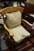 A traditional beech frame kitchen carver chair with loose cushions