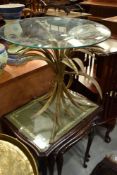 A modern glass top occasional table having gilt metal base in the form of wheatsheaf, diameter