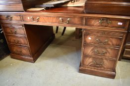 A reproduction Regency style pedestal desk having leather skiver top , large proportions approx