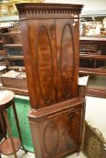 A nice quality reproduction Regency corner cupboard, height approx. 175cm, key present