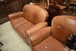 A pair of tan leather settees, worn effect patina, width approx. 150cm each