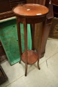 An Edwardian mahogany plant stand having circular top and undertier, diameter approx 30cm, height