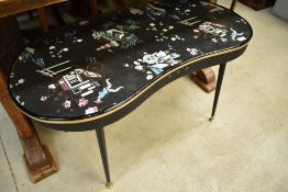 A mid Century vintage kidney shaped coffee table on dansette style legs with Chinoiserie style top