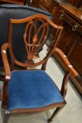 An early 20th Century mahogany frame carver chair having shield back with typical sheraton style