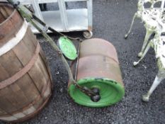 A vintage cast iron garden roller