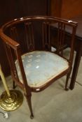 An Edwardian mahogany salon armchair having stylised rail back on fine cabriole legs