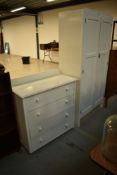 A vintage painted wardrobe and similar four drawer chest