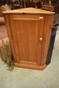 A vintage pine floor standing corner cupboard, height approx. 101cm