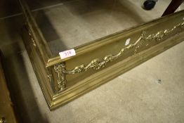A traditional brass fine fender