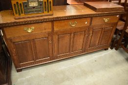 A top quality oak sideboard in the period style, by Nigel Griffiths of Matlock, triple frieze