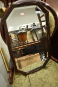 An early 20th Century oak wall mirror having shaped frame approx. 61 x 38cm