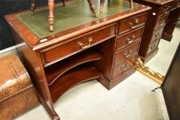 A reproduction Regency mahogany desk having single drawer pedestal, width approx. 107cm