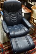 A Stressless chair and footstool, in deep blue