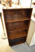 An early 20th Century oak narrow bookshelf