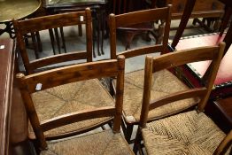 A set of six 19th Century rush seated rail back kitchen chairs, some with simulated bamboo