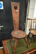 A traditional mahogany frame love token style spinning chair